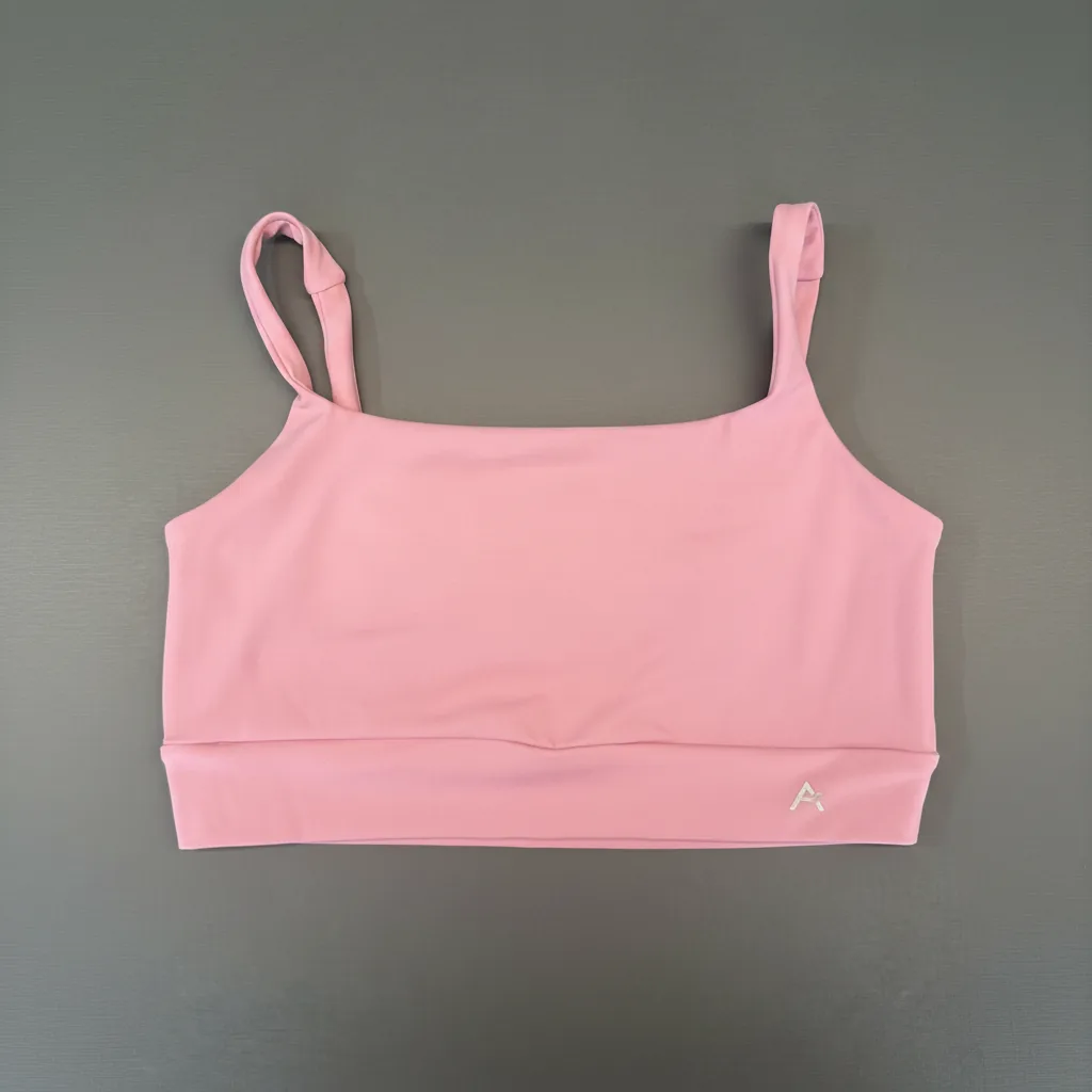 Top Essencial com Bolso Rosa Boost — peça de frente